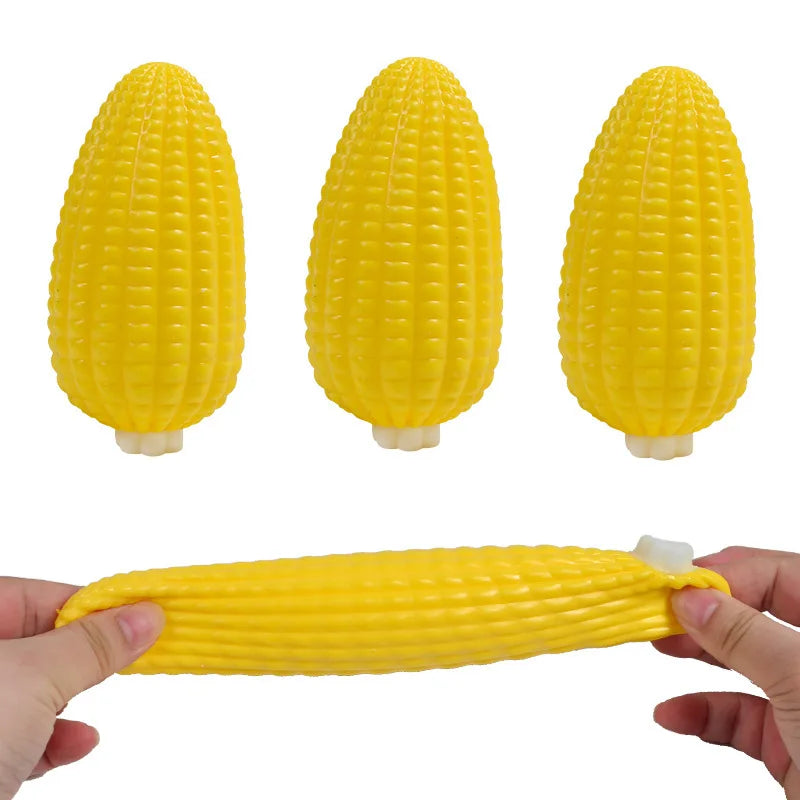 A set of three yellow corn-shaped squishy stress balls, shown individually and being held by hands.
