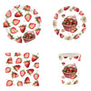 A set of strawberry theme birthday party decorations including ornaments and a banner.
