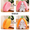 Two plush pillows: one pink strawberry and one orange pumpkin, both featuring a white bunny face.