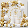 A balloon garland featuring white and gold latex balloons with confetti arranged in an archway.