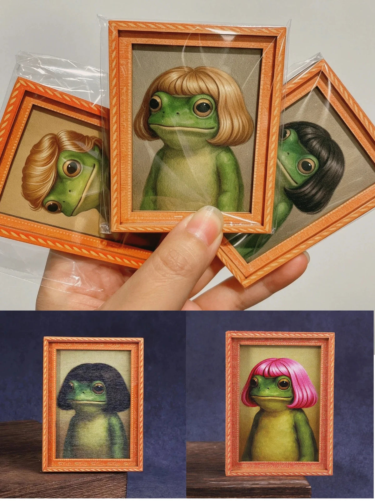 A hand holds an open wooden photo frame displaying a painting of a green frog with blonde hair.