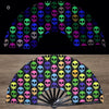 A folding fan featuring a pattern of neon and dark colored skulls.