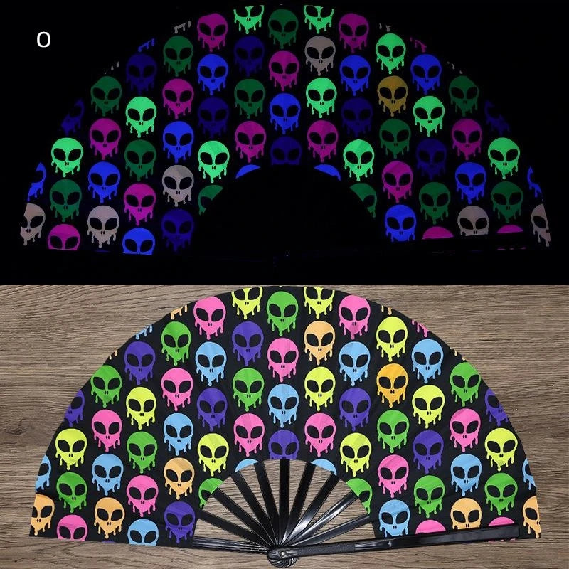 A folding fan featuring a pattern of neon and dark colored skulls.