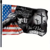 A black banner flag features a depiction of Jesus and a hand holding an American flag.
