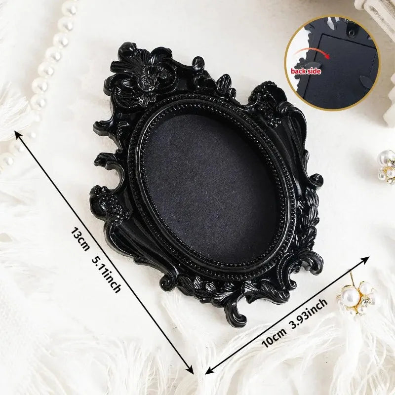 Black vintage resin mini picture frame with ornate carving and a white pearl border
