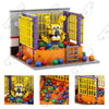 A detailed building block set model of a Five Nights at Freddy's character in a yellow and purple enclosure.