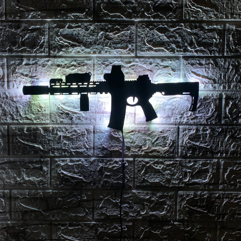 A black gun-shaped LED light fixture mounted on a stone brick wall.
