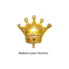 A golden foil crown balloon with decorative points and jewels for birthday and party decor.