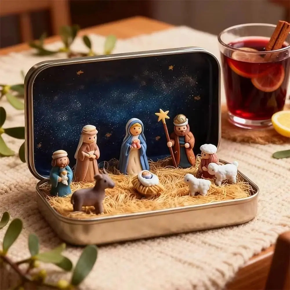 A tin containing a nativity scene figurine set featuring figures like Mary, Joseph, and baby Jesus surrounded by straw.