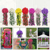 A display of artificial violet ivy hanging garlands in various colors like pink, red, yellow, and purple.