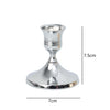Silver vintage iron candlestick holder with a flared base and cup, shown in a side view.
