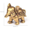 A small antique bronze elephant figurine used as a tea pet or table ornament.