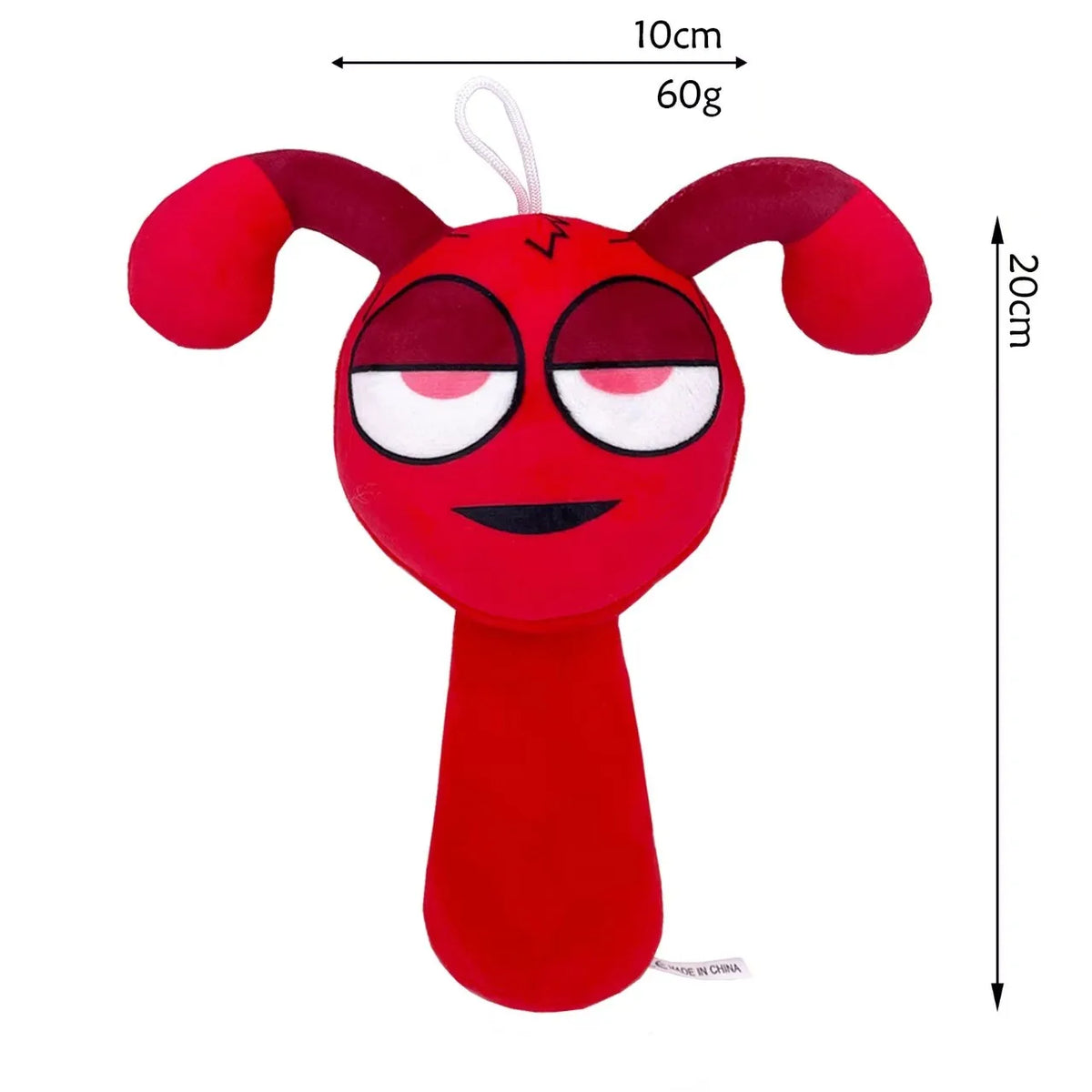 A bright red collectible plush toy shaped like a stylized face with large ears and a small body.