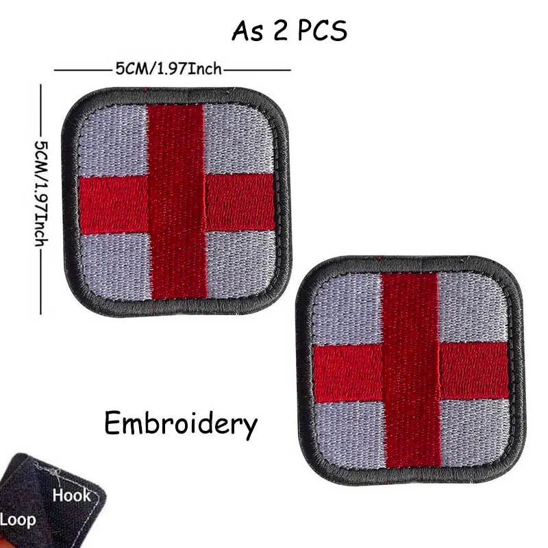 Two red and gray embroidered medical cross tactical morale patches with a hook and loop.