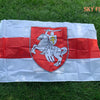 A white banner featuring a red horizontal stripe and a central shield with a mounted knight.