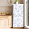 A vertical refrigerator with a light gray floral pattern is displayed next to wooden cabinetry and a window.