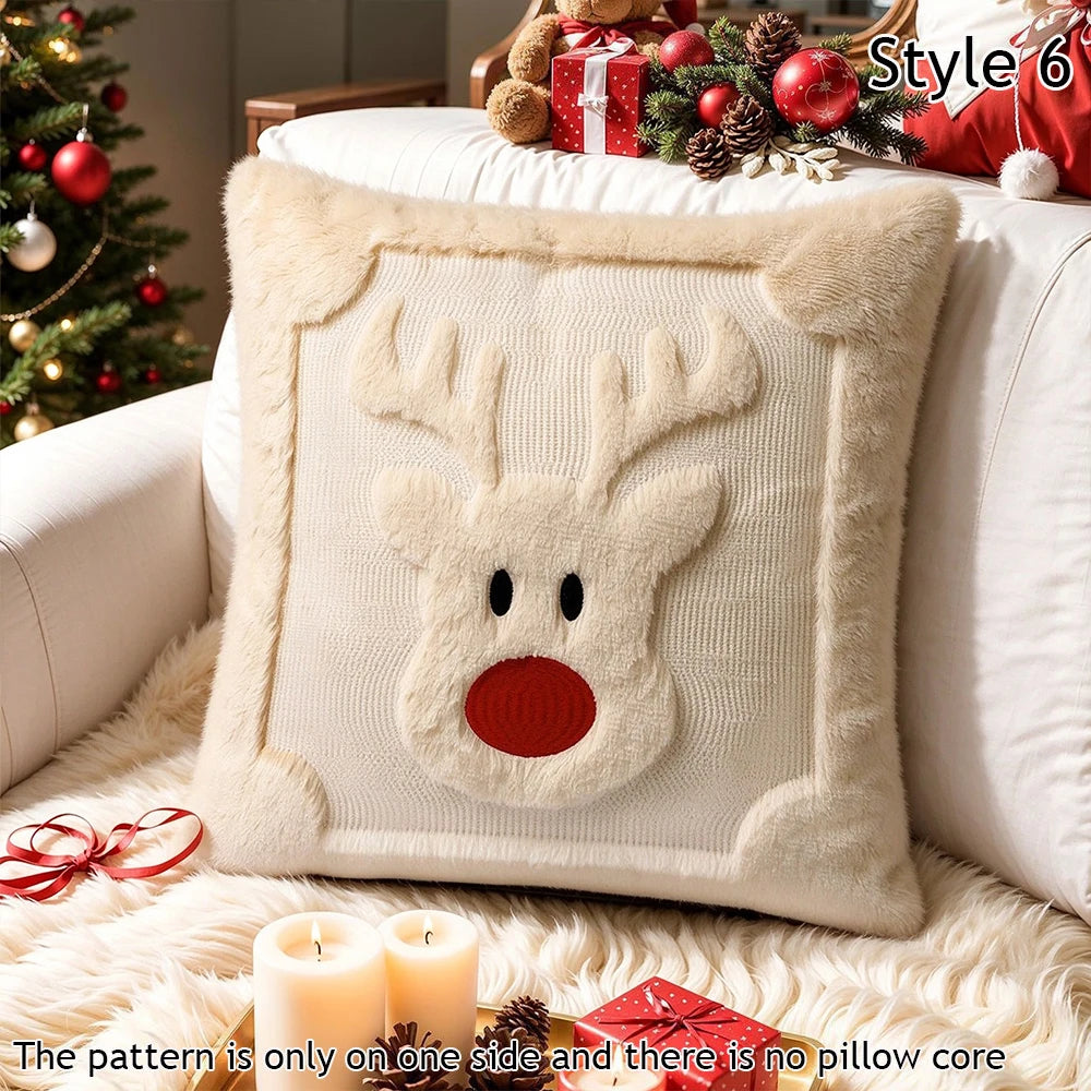 A cream-colored decorative pillow featuring a reindeer face design with red accents and faux fur trim.