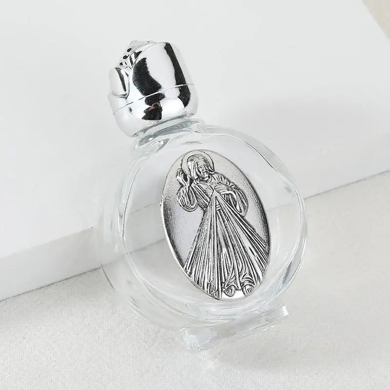 Decorative glass bottle with a silver figurine inside and a twist cap