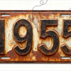 A vintage style aluminum license plate with the year 1955 embossed on it, showing signs of rust and weathering.