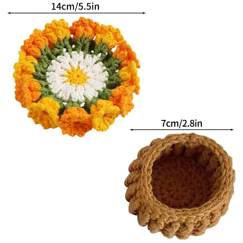 Hand-crocheted rose flower coasters featuring orange and white yarn petals.
