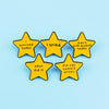 Five yellow star enamel pins with sarcastic quotes about surviving, trying, and not committing arson