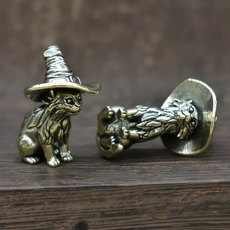 Vintage brass cat statue with a witch hat and a lion head