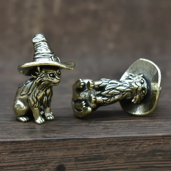 Vintage brass cat statue with a witch hat and a lion head