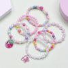 A set of six beaded bracelets featuring pink, purple, and blue stones in various shades and designs.