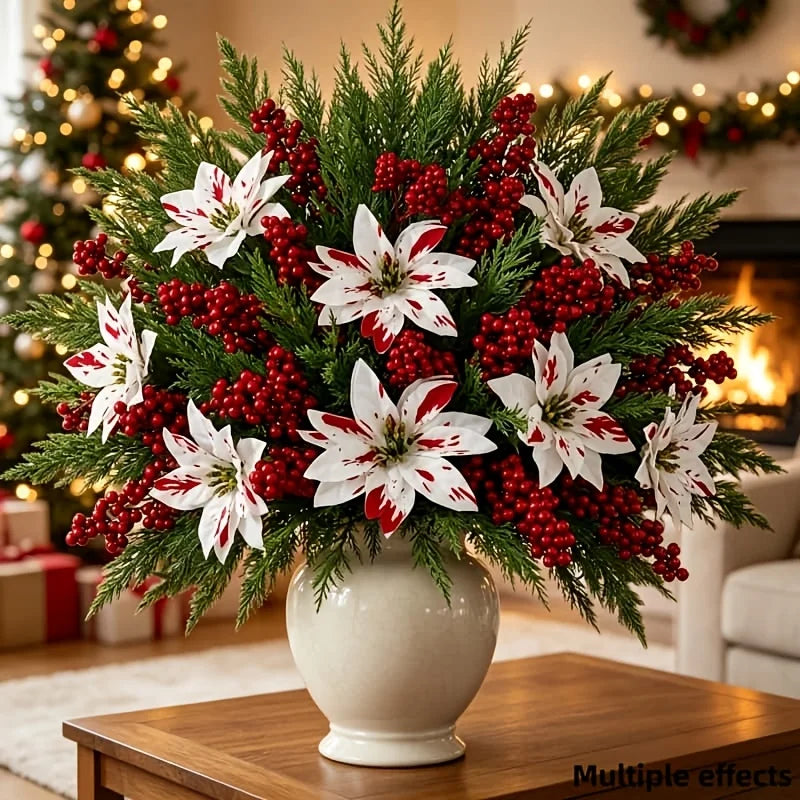 A bouquet of festive red and white artificial flowers featuring spiky greenery and clusters of berries in a white vase.