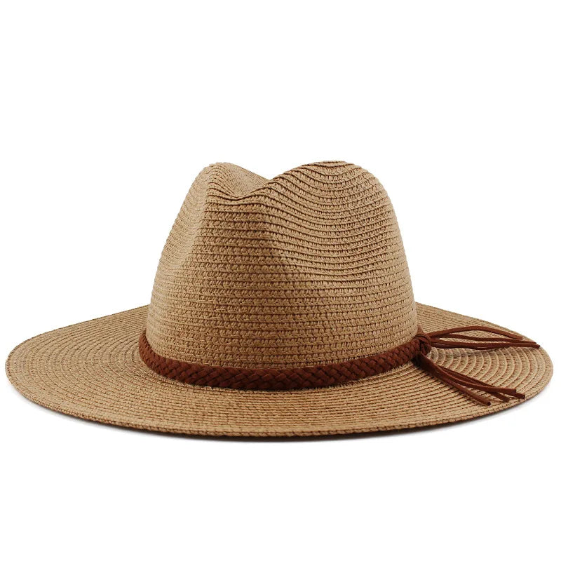 A wide brim straw sun hat in tan with a brown cord detail.