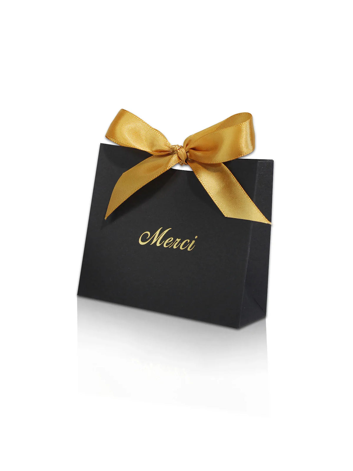 A black paperboard thank you gift bag tied with a gold ribbon, featuring the word Merci printed on it.