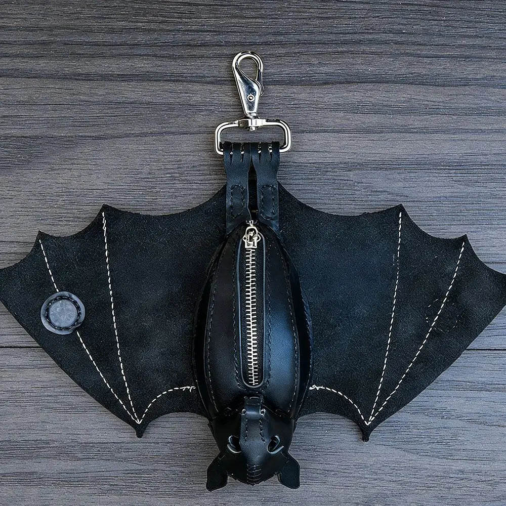 Black leather bat-shaped wallet keychain with a zipper coin purse