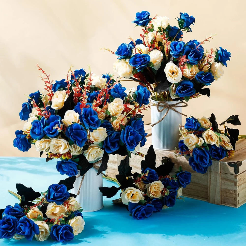 A vibrant bouquet of artificial silk roses in shades of blue and cream arranged in a rustic wooden box.