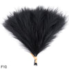 A bundle of black artificial reed or pampas grass used for home and event decor.