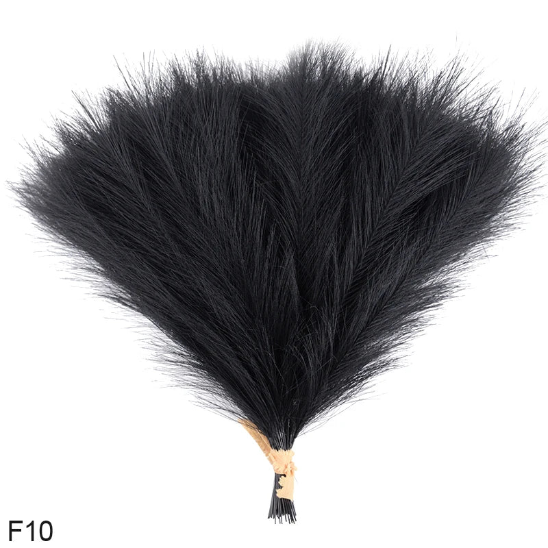 A bundle of black artificial reed or pampas grass used for home and event decor.