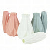 A collection of tall, tapered plastic vases in pink, white, and gray shades.