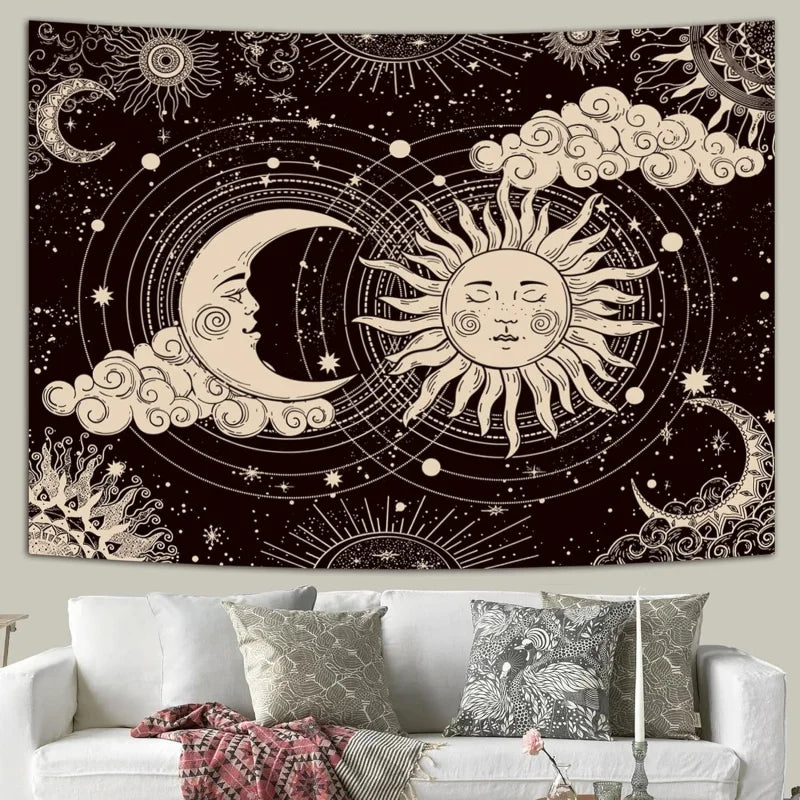 A dark tapestry wall hanging featuring a celestial design with a crescent moon and a sun surrounded by stars and clouds.