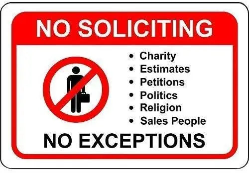 A red and white sign prohibiting soliciting, including charities, estimates, petitions, politics, religion, and sales people,
