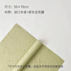 A sheet of light green decorative packaging paper with a rolled edge, used for flower petal decoration.