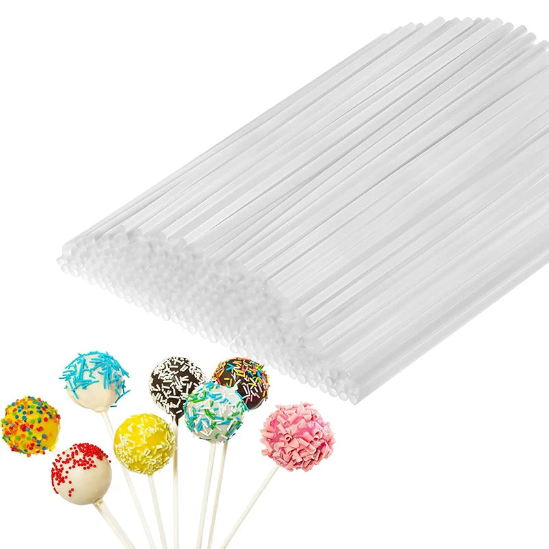 A bundle of white lollipop sticks for candy making with various colored and textured lollipops displayed below.