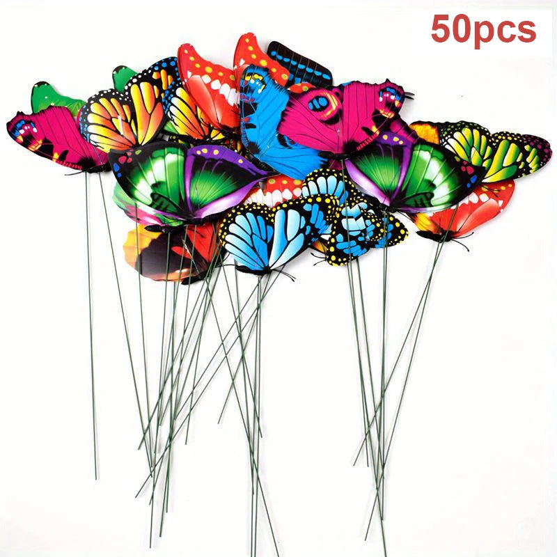 A collection of colorful paper butterflies on thin green stakes for garden decoration.