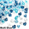 A pile of decorative blue and clear acrylic ice rocks and crystals.