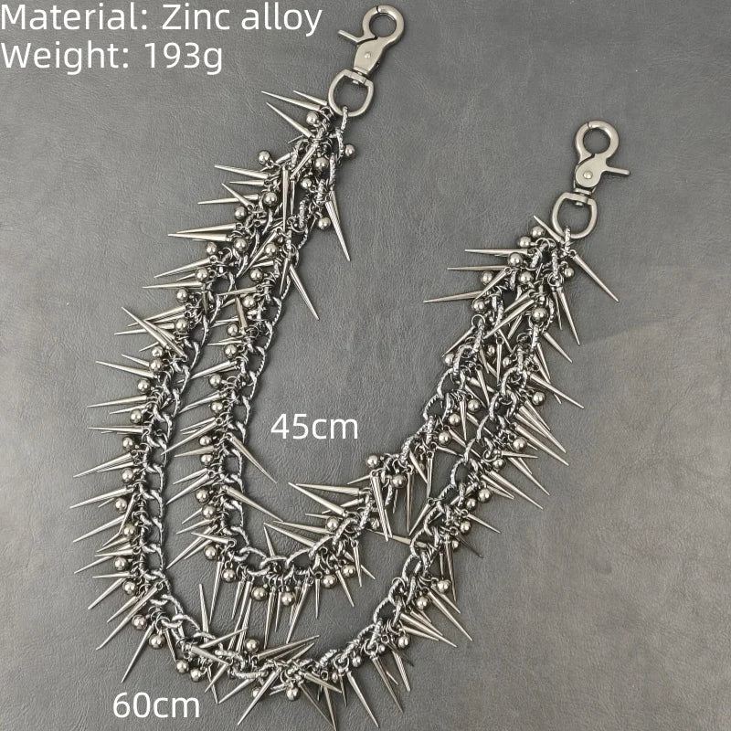 A silver zinc alloy necklace featuring numerous sharp rivets and spikes, displayed against a gray background.
