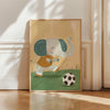 A canvas print featuring a cute, stylized elephant in an orange outfit playing soccer on green grass.