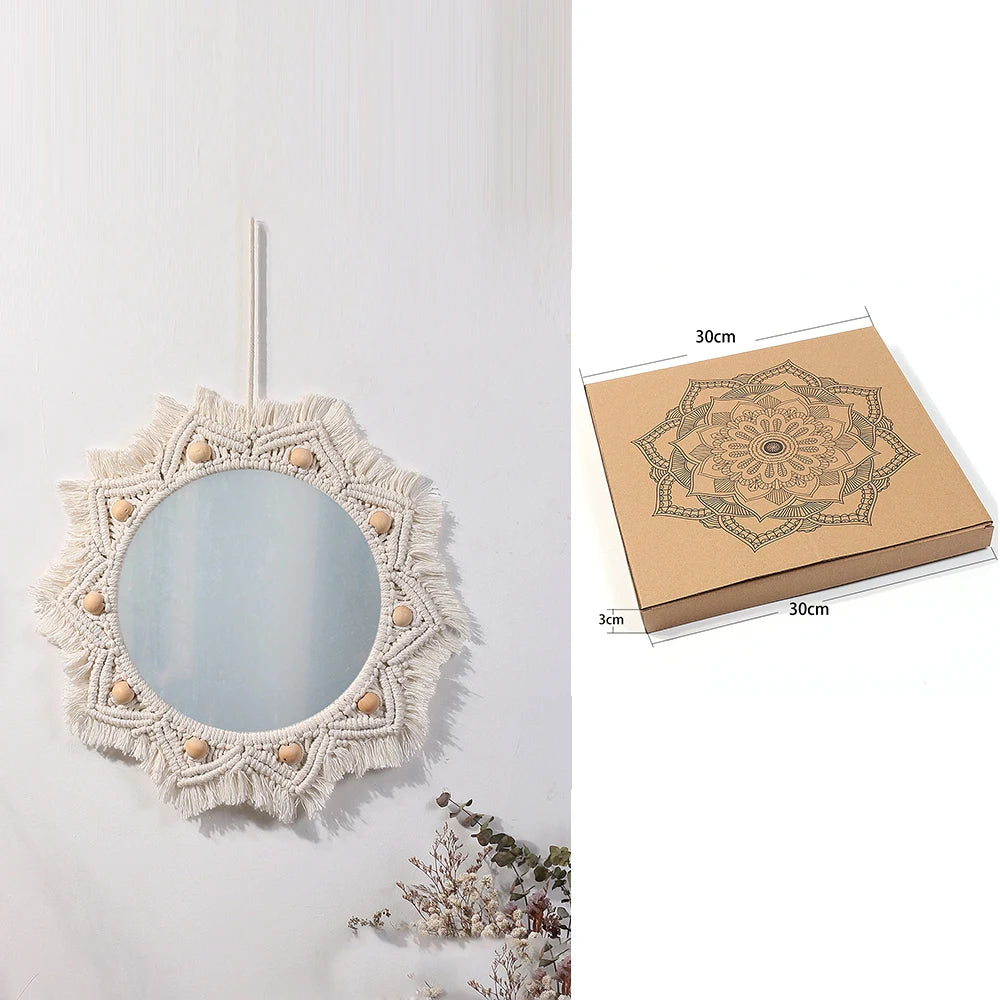 Boho macrame round wall mirror with a distressed white fringe hanging on a white wall.