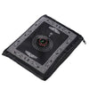 Black portable travel prayer mat with an embedded compass design