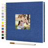 A blue linen cover scrapbook album with a gold-colored plastic sheet visible on the front.