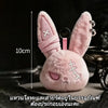 Pink fluffy bunny plush keychain with embroidered details