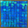 A grid of iridescent blue and green sequin shimmer wall panels used as a sparkling backdrop.