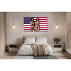 A tapestry featuring the American flag design with two women in patriotic attire hanging on a wall.